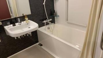 Combined shower/tub, free toiletries, hair dryer, slippers