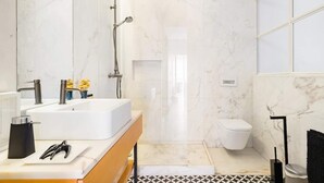 A modern bathroom with a large white sink, a handheld showerhead, and a toilet. - Modern flat by Time Out Food Market (Very Central) (Lisboa)