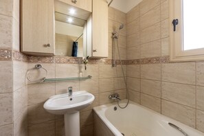 Combined shower/bathtub, hair dryer