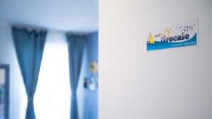 A hotel sign with the name 'Grecale' and the tagline 'Exclusive Emotions'. - Versomare - Room Grecale - extra Bed On Demand (Polignano A Mare)