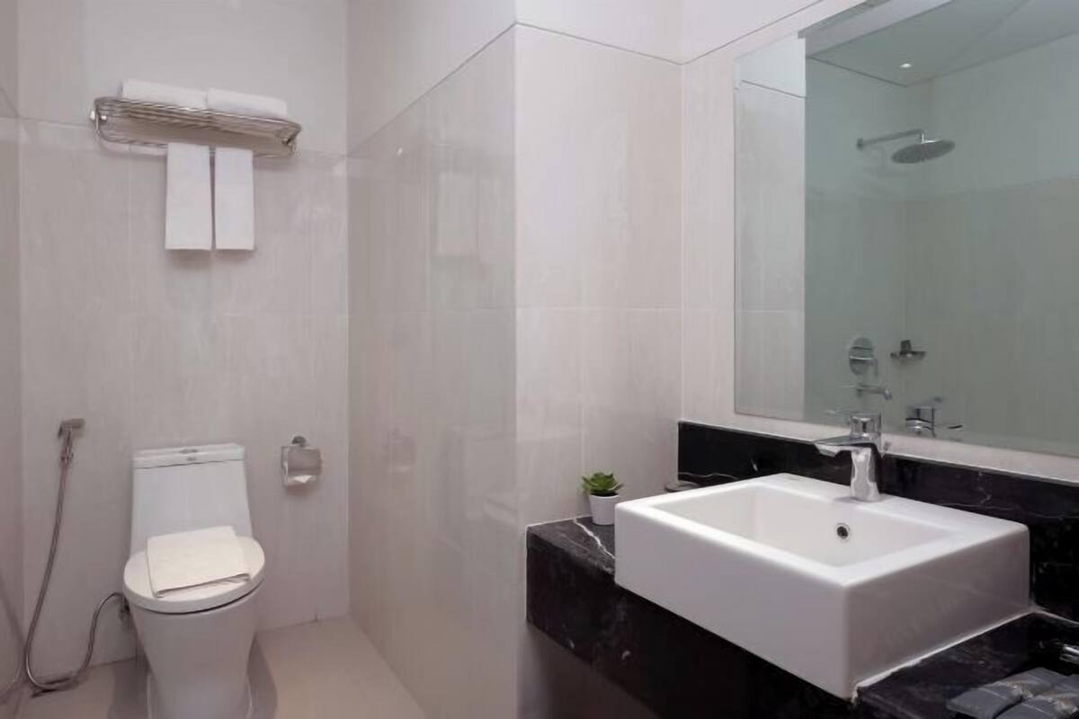 Shower, free toiletries, slippers, towels