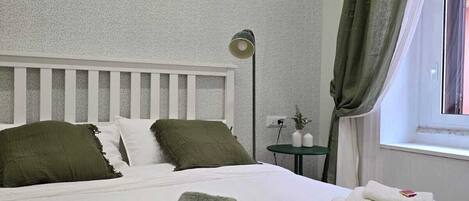 1 bedroom, desk, iron/ironing board, travel crib