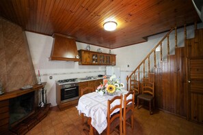 Enjoy meals in the kitchen with a stove and dining area.