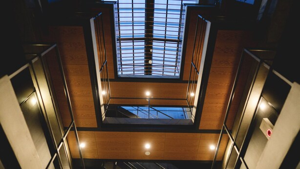 A multi-level interior with a central open space and staircases. - So Kyoto Fushimi Inari (Kyoto)