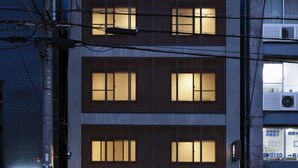 A multi-story building with illuminated windows and a visible entrance. - So Kyoto Fushimi Inari (Kyoto)
