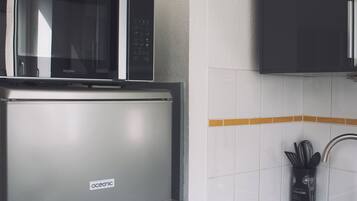 Microwave, coffee/tea maker, cookware/dishes/utensils