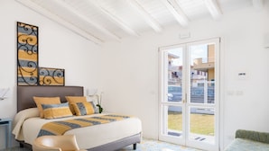 A bedroom with a bed, a chair, a large window, and a view of a pool. - La Foresteria di Maestina (Barcellona Pozzo di Gotto)