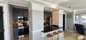 Fridge, stovetop, coffee/tea maker, dining tables