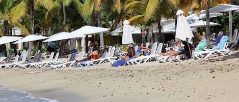 On the beach, sun-loungers, beach towels