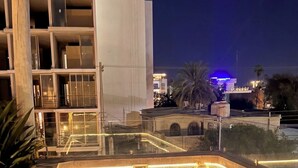 A nighttime view of a swimming pool with tiled flooring and a central drain. - New Modern Condo, Private Pool, close to the Malecon & Marina Cortez La Paz BCS (La Paz, B.C.S.)