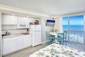 Fridge, microwave, stovetop, coffee/tea maker