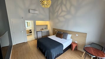 1 bedroom, laptop workspace, blackout drapes, iron/ironing board