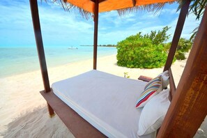 On the beach, sun-loungers, beach towels