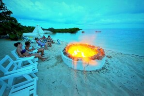 On the beach, sun-loungers, beach towels