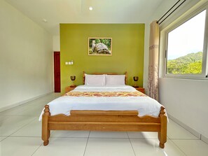 Deluxe Apartment, 2 Bedrooms, Mountain View | Minibar, in-room safe, blackout curtains, iron/ironing board - The Seaboards Apartments Seychelles (Mahé Island)