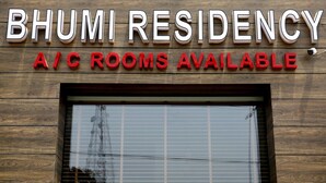 A sign for Bhumi Residency advertising A/C rooms available.