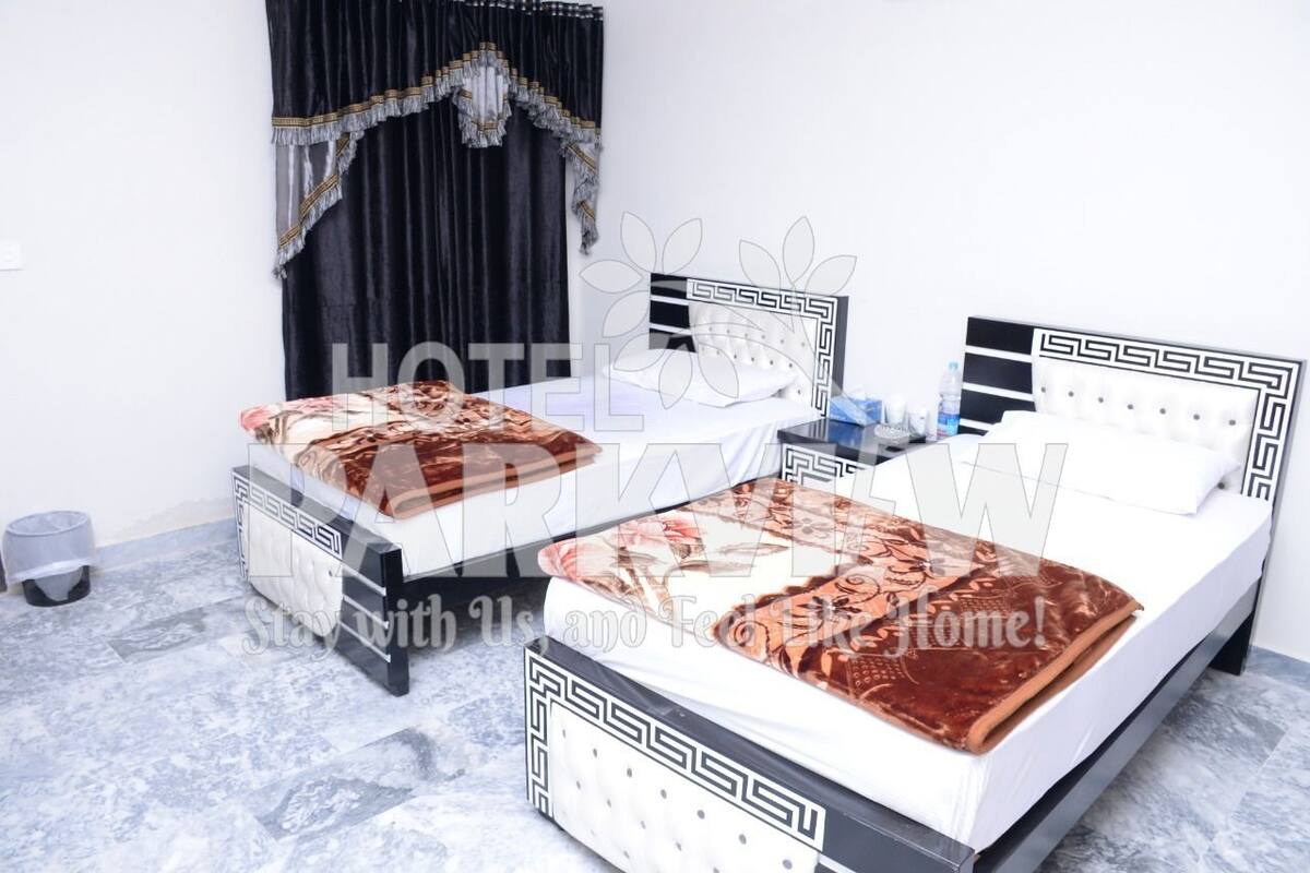 Doppelzimmer zur Einzelnutzung, 2 Schlafzimmer, Gartenblick | Zustellbetten