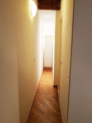 Simple, functional design leads to a cozy room with a white door.