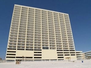 A high-rise hotel with multiple floors, a flat roof, and a uniform facade. - 2 Bedroom/2 Bath Beachfront!  (Panama City Beach)