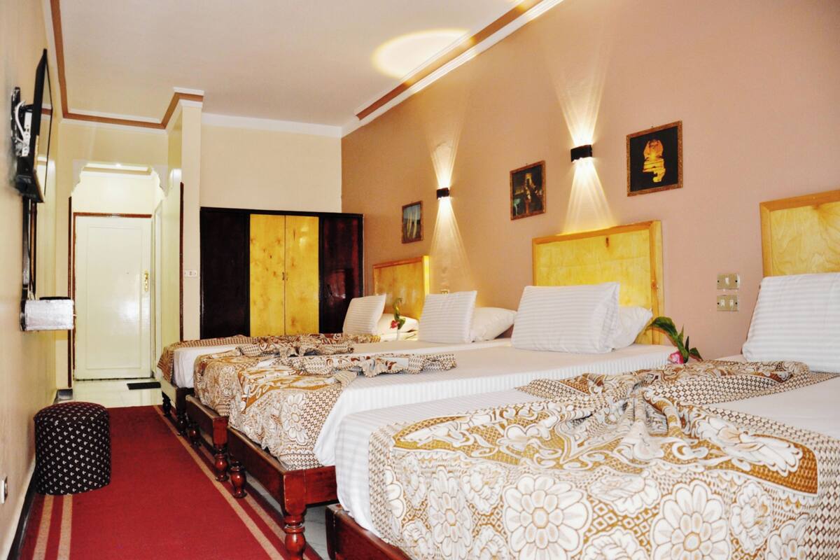 family room, city view | 1 bedroom, in-room safe, blackout curtains, free wifi