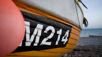 A close-up of a boat with the number "M214" on its side.