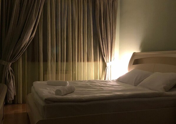 Premium bedding, down duvets, blackout curtains, soundproofing