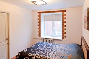 Apartment, Mehrere Betten, Stadtblick | Schallisolierte Zimmer, Bügeleisen/Bügelbrett, kostenloses WLAN