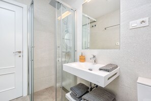 Bathtub, hair dryer, towels, soap