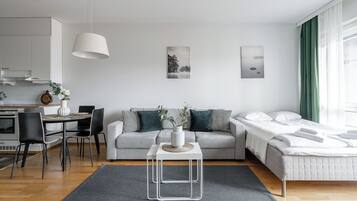 Superior Apartment, 1 Bedroom, Sauna, Lake View | Living room | 55-inch Smart TV with cable channels, TV