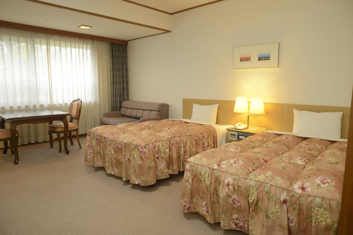 western room for 3 guests with private bathroom, partial ocean view, non smoking | in-room safe, free wifi, bed sheets