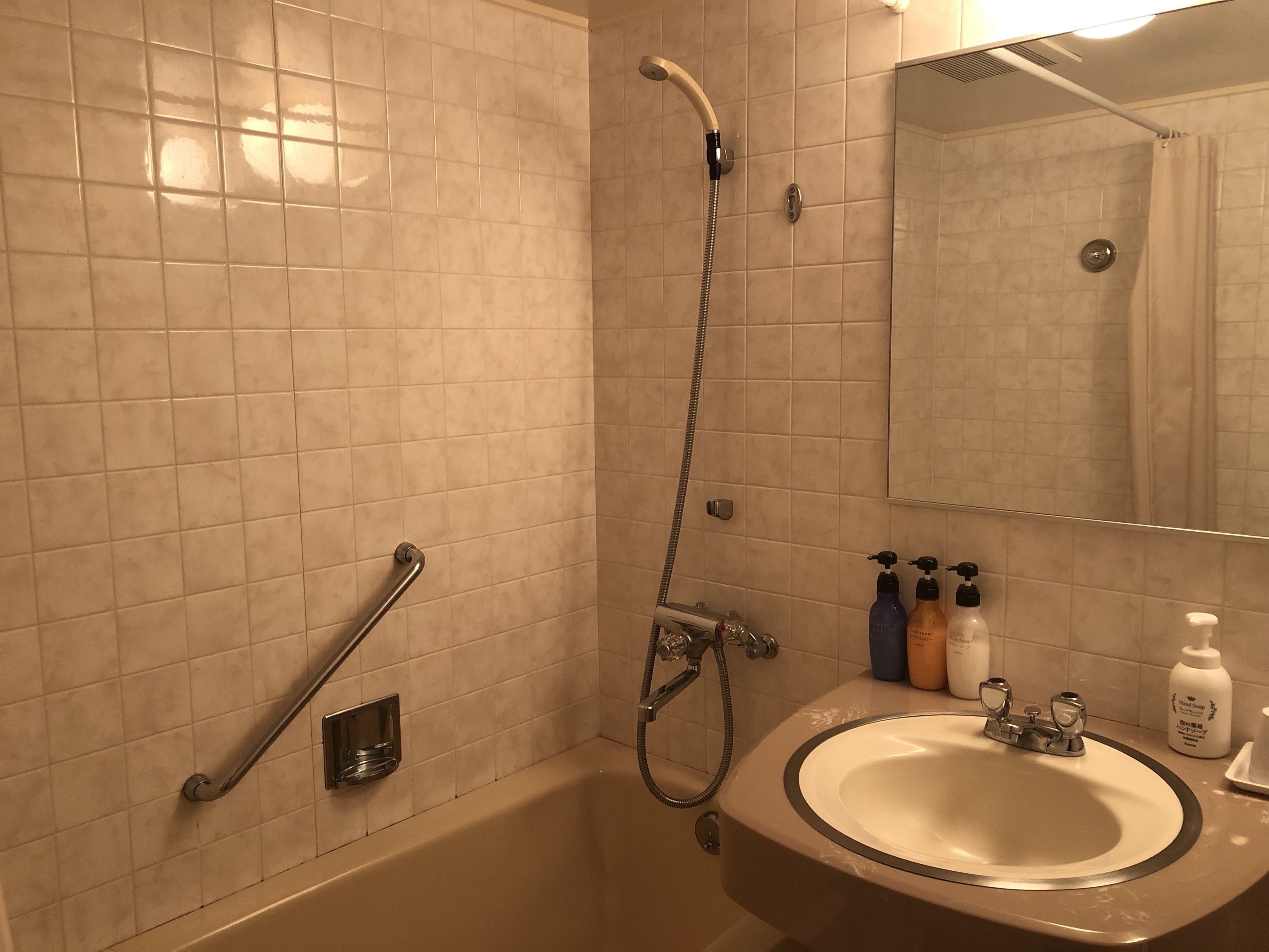 hair dryer, slippers, bidet, towels