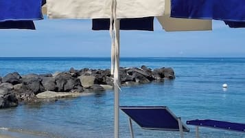 On the beach, sun loungers