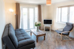 Classic Apartment, 2 Bedrooms, Non Smoking, 2 Bathrooms | Living room | Flat-screen TV, DVD player