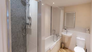 Economy Apartment, 1 King Bed with Sofa bed, Non Smoking | Bathroom | Separate tub and shower, free toiletries, hair dryer, towels
