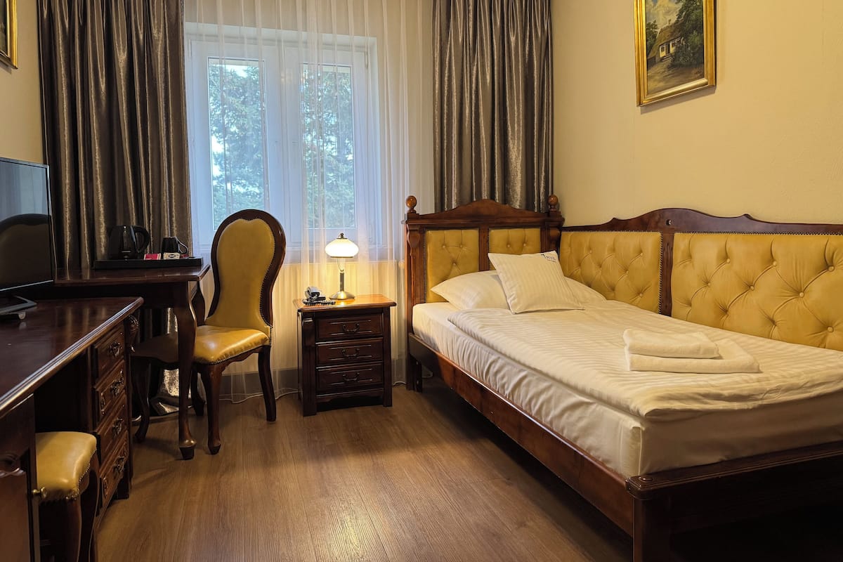 Quarto solteiro standard | Individualmente mobiliados, cortinas blackout, Wi-Fi de cortesia