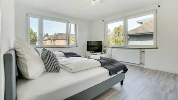 Deluxe Apartment, 3 Bedrooms | Living area | Smart TV