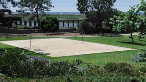 A golf course with a sand bunker, a picnic table, and a view of the ocean. - Del Mar Beaches~Luxury Ocean View Townhouse! (Del Mar)