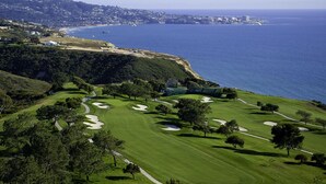 A golf course with bunkers, trees, and a view of the ocean. - Del Mar Beaches~Luxury Ocean View Townhouse! (Del Mar)