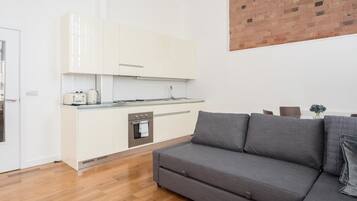 Standard Apartment, Multiple Beds, Non Smoking | Living area | TV