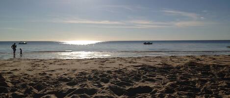 On the beach, sun-loungers