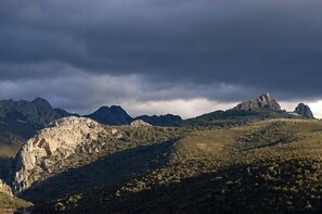 A mountainous landscape with rugged terrain and rocky outcrops.
