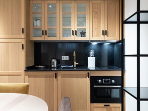 Fridge, microwave, stovetop, coffee/tea maker