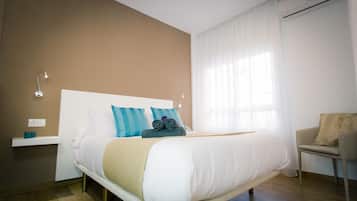 1 dormitorio, tabla de planchar con plancha, cuna de viaje y wifi gratis