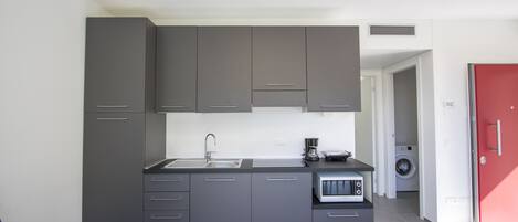 Fridge, microwave, stovetop, coffee/tea maker