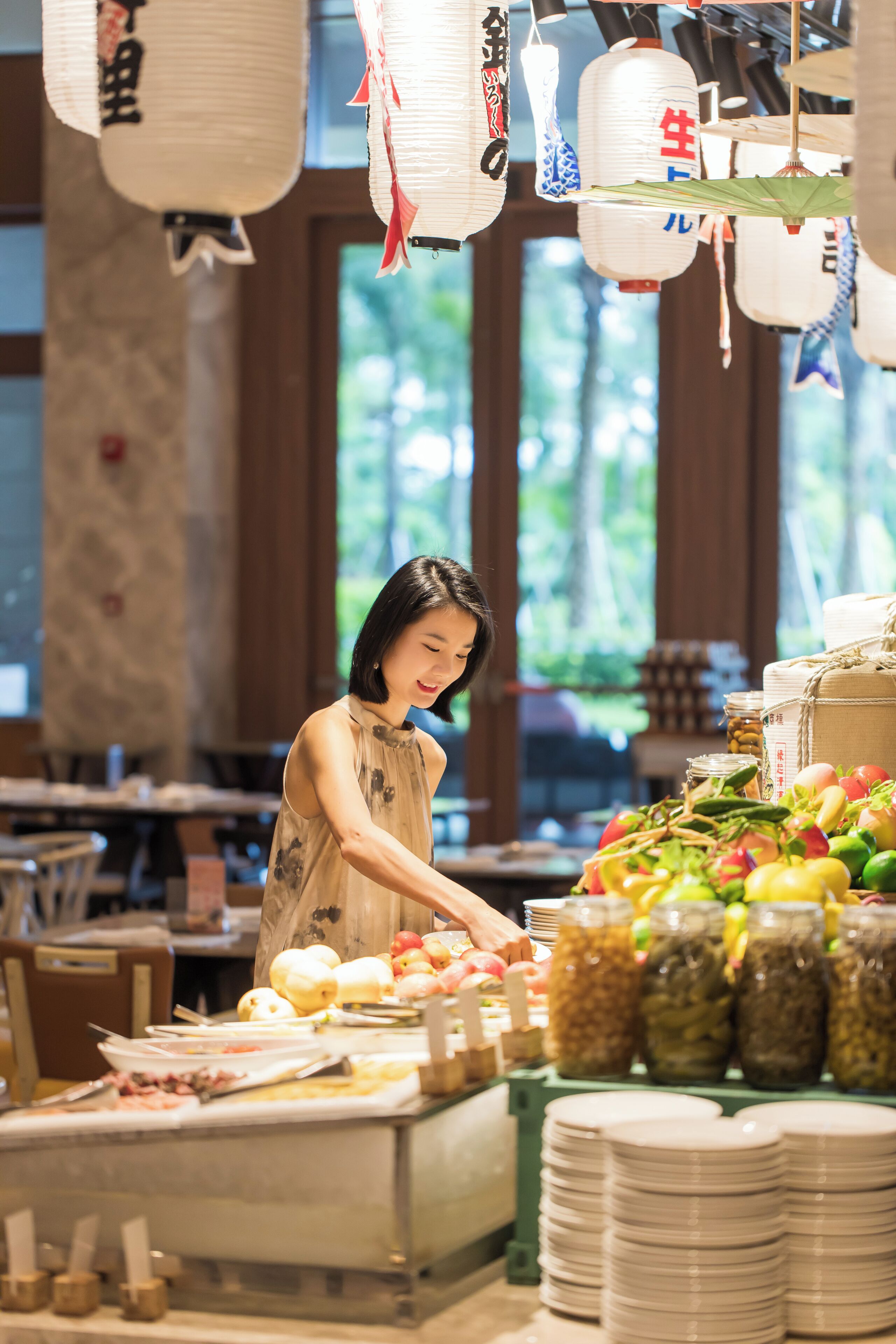 A buffet setup with various food items and condiments.