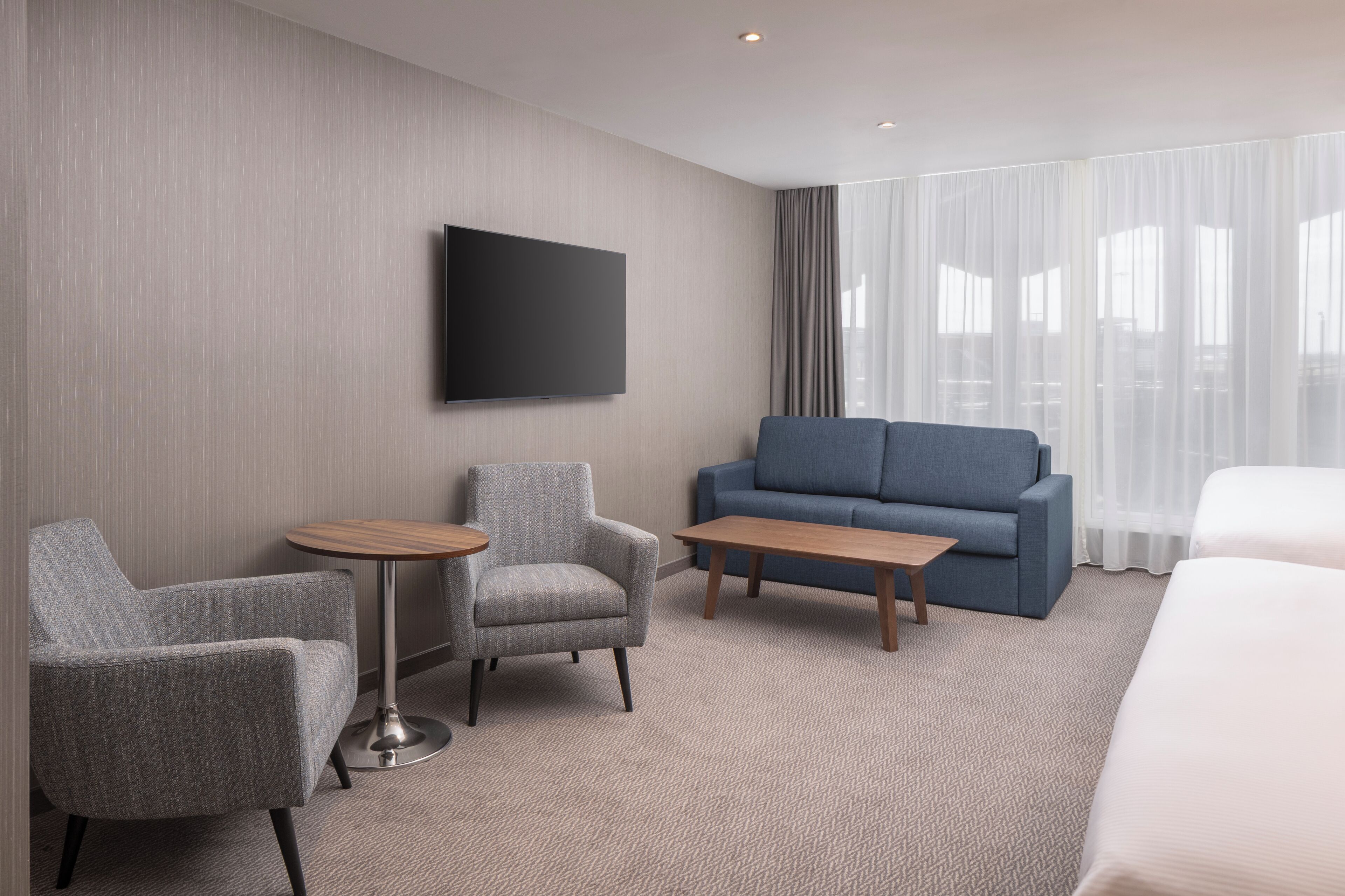 family room, multiple beds | in-room safe, blackout curtains, soundproofing, iron/ironing board