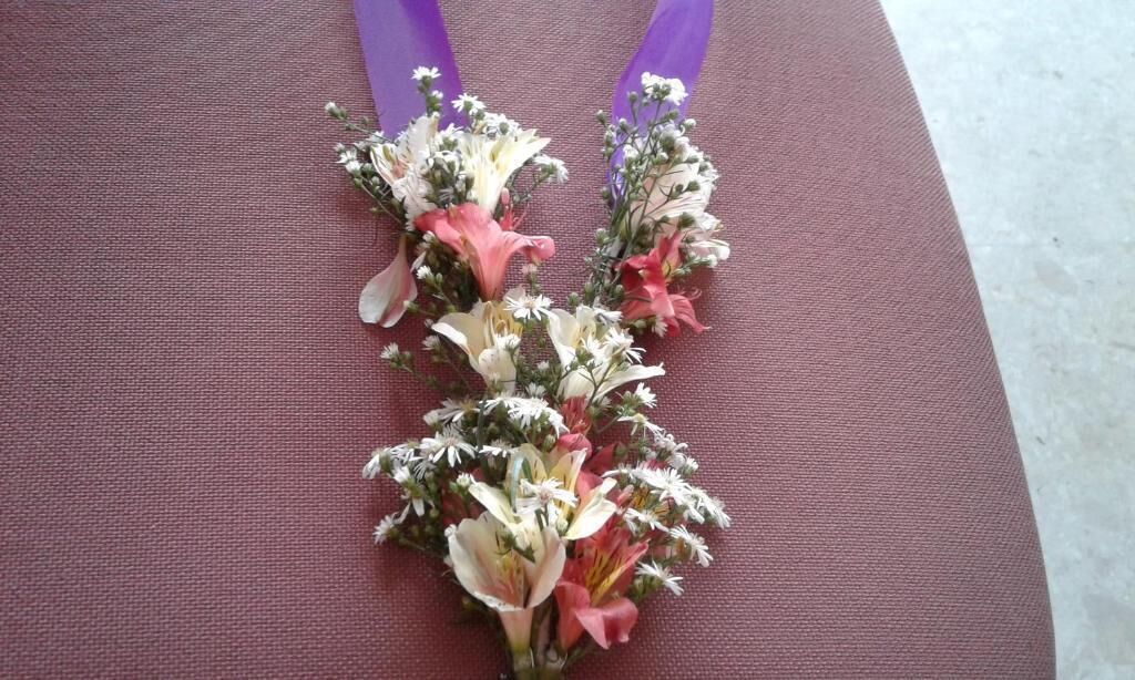 A bouquet of flowers on a chair.