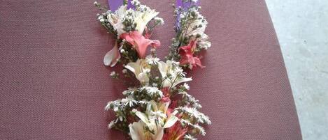 A bouquet of flowers on a chair.
