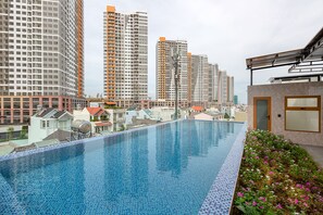 Outdoor pool, open 6:00 AM to 9:00 PM, sun loungers