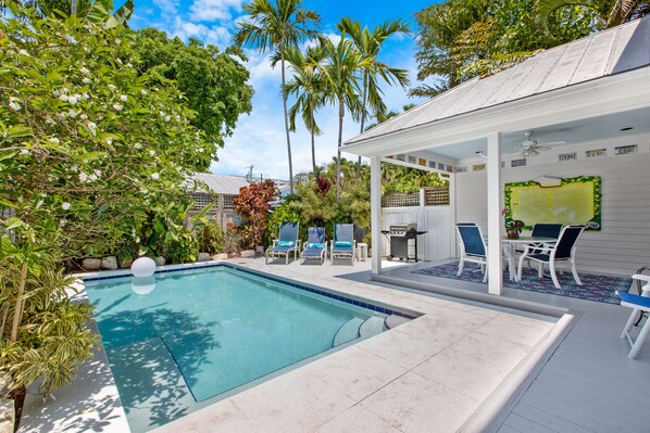 A heated pool, sun loungers